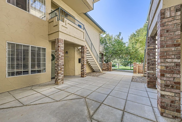 8767 E Dry Creek Rd Unit 1312, Englewood, CO 80112 - view of patio / terrace with stairs