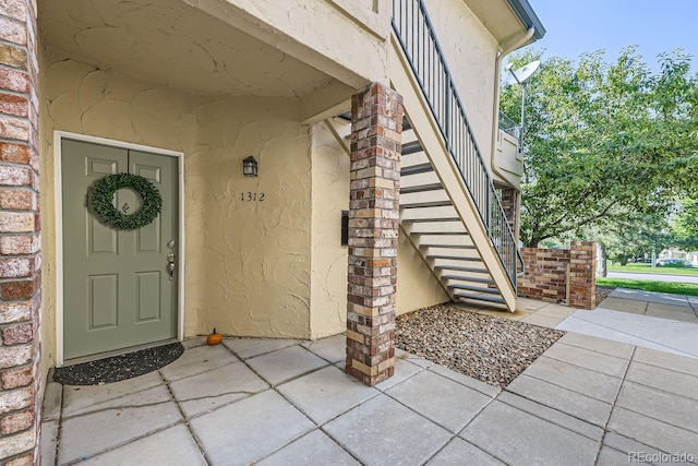 entrance to property with a patio area