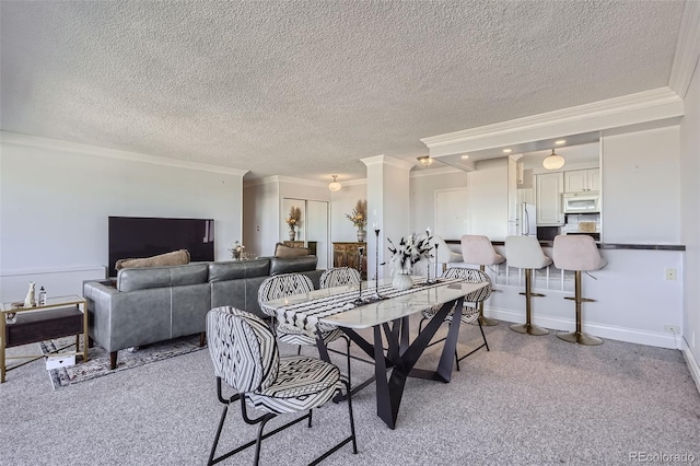 carpeted dining room featuring a textured ceiling and crown molding