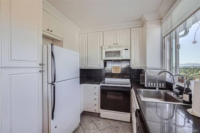 kitchen featuring decorative backsplash, white cabinetry, white appliances, light tile patterned floors, and sink