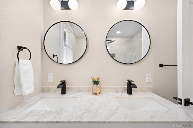 full bath with double vanity and a sink