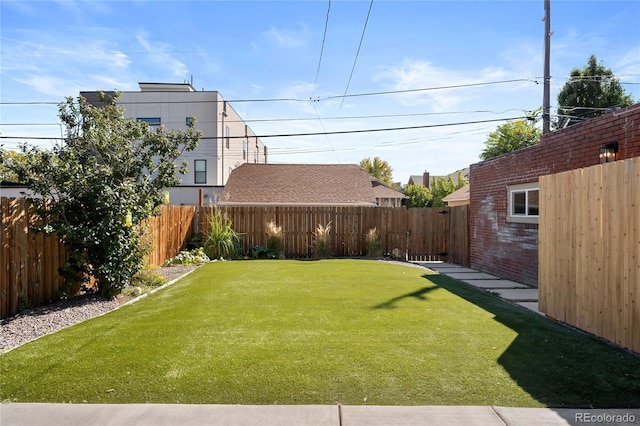 view of yard featuring a fenced backyard