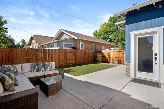 view of patio featuring an outdoor hangout area and a fenced backyard