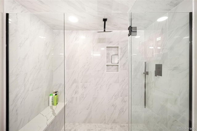 full bath with a marble finish shower