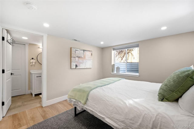 bedroom with recessed lighting, baseboards, visible vents, and light wood-style flooring