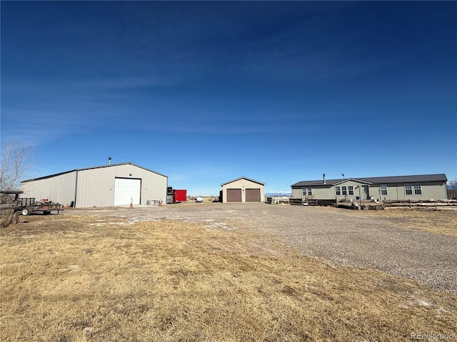 view of yard with an outdoor structure and a garage