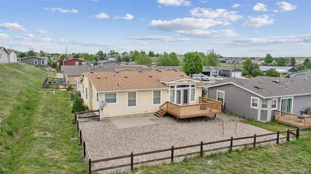 4481 Kingfisher Pt, Colorado Springs, CO 80922 - back of property featuring a wooden deck, a residential view, and a patio
