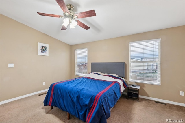 4481 Kingfisher Pt, Colorado Springs, CO 80922 - carpeted bedroom featuring baseboards, vaulted ceiling, and ceiling fan