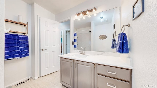 10517 Clermont Way, Thornton, CO 80233 - bathroom with vanity and a shower