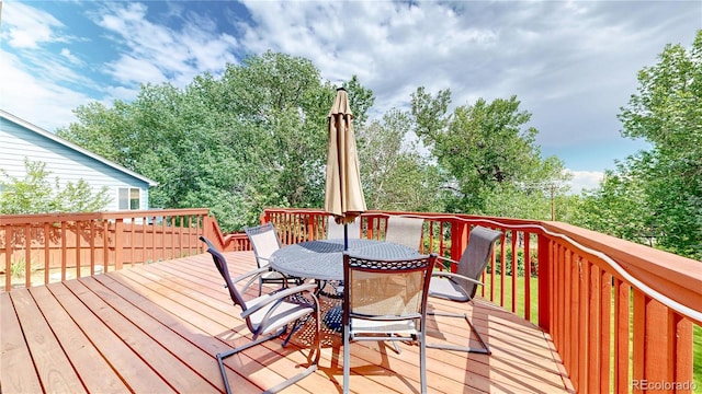 10517 Clermont Way, Thornton, CO 80233 - wooden deck featuring outdoor dining space