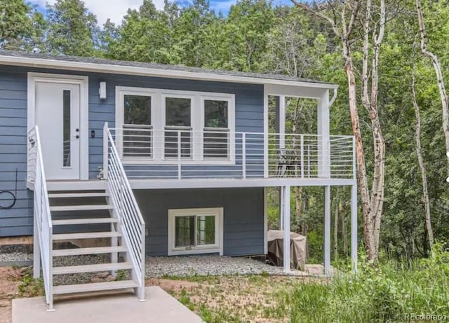 back of property with stairway