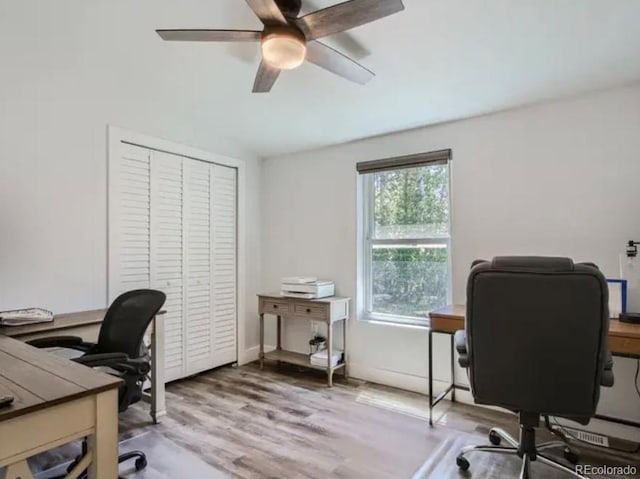 office featuring baseboards, wood finished floors, and ceiling fan