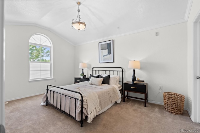 carpeted bedroom featuring ornamental molding and lofted ceiling