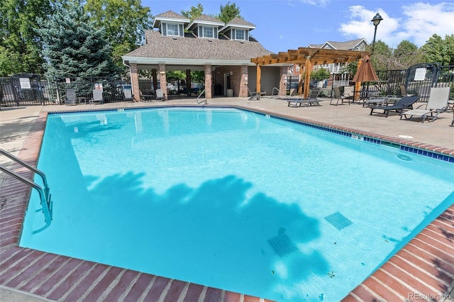 view of swimming pool with a pergola and a patio area