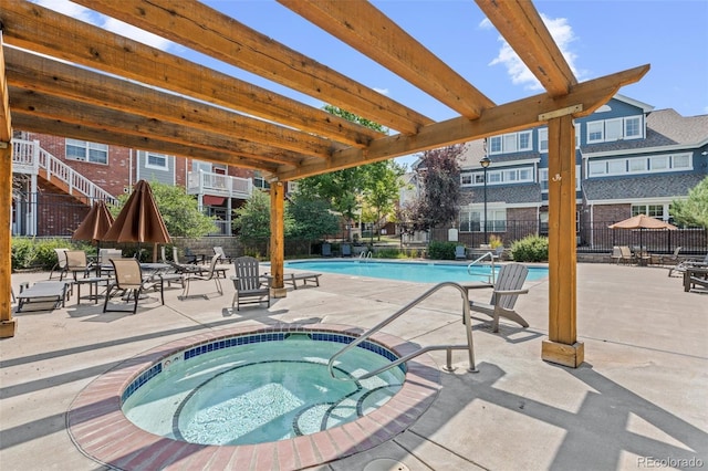 view of pool featuring a patio and a hot tub