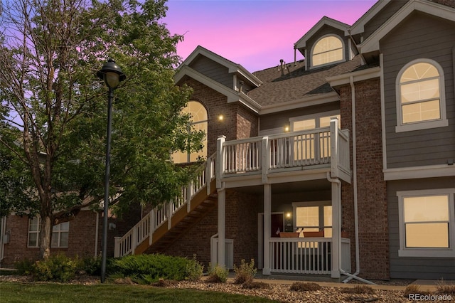 view of back house at dusk