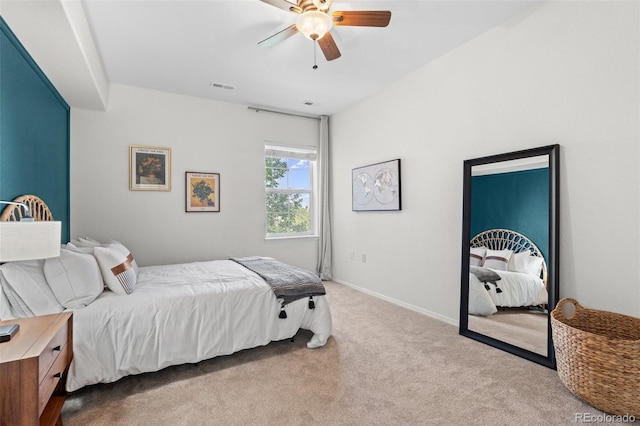 bedroom featuring light carpet and ceiling fan