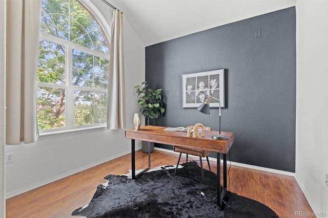 office space with wood-type flooring and lofted ceiling