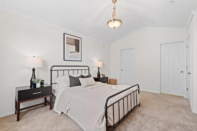 carpeted bedroom featuring ornamental molding and lofted ceiling