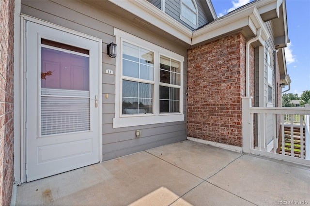 doorway to property with a patio area