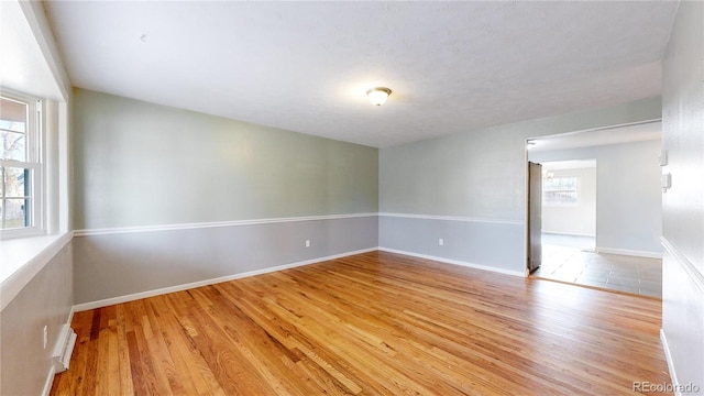 spare room with light hardwood / wood-style flooring