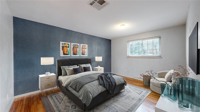 bedroom featuring hardwood / wood-style flooring