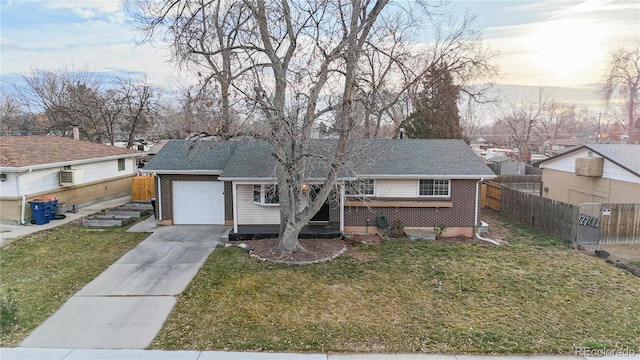 view of front of house with a lawn and a garage