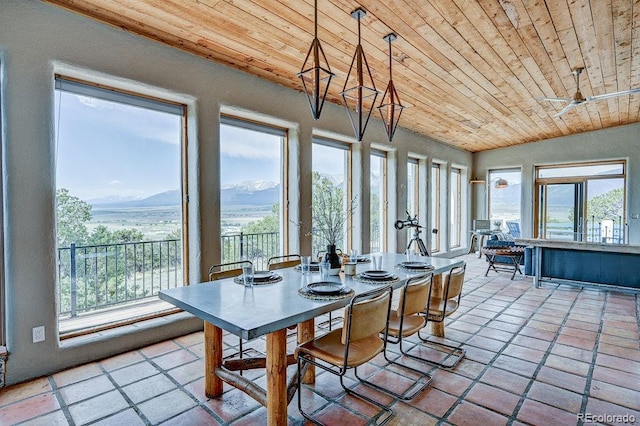 28700 County Road 304, Buena Vista, CO 81211 - dining area featuring wooden ceiling, healthy amount of natural light, a mountain view, and tile patterned flooring