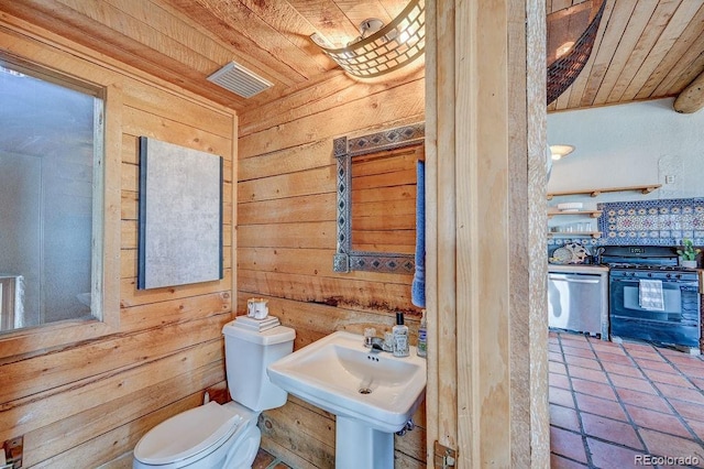 28700 County Road 304, Buena Vista, CO 81211 - half bath with wood ceiling, wood walls, and tile patterned floors