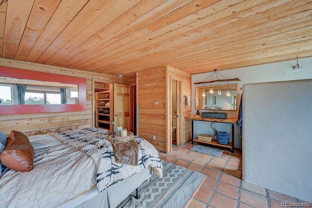 28700 County Road 304, Buena Vista, CO 81211 - bedroom featuring wood ceiling, wood walls, and tile patterned floors