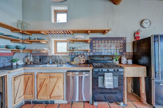 28700 County Road 304, Buena Vista, CO 81211 - kitchen featuring appliances with stainless steel finishes, open shelves, decorative backsplash, and a textured wall