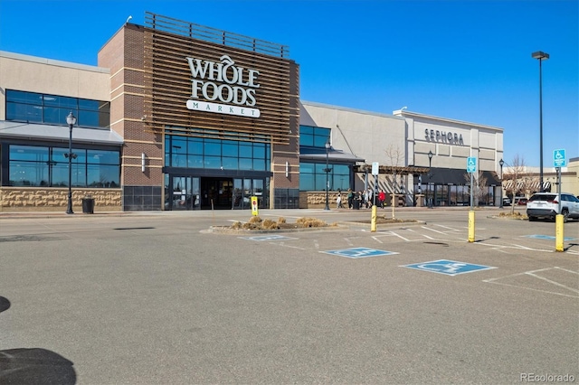 view of property with uncovered parking