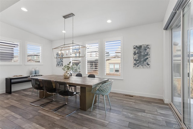 dining room featuring a wealth of natural light, recessed lighting, baseboards, and wood finished floors