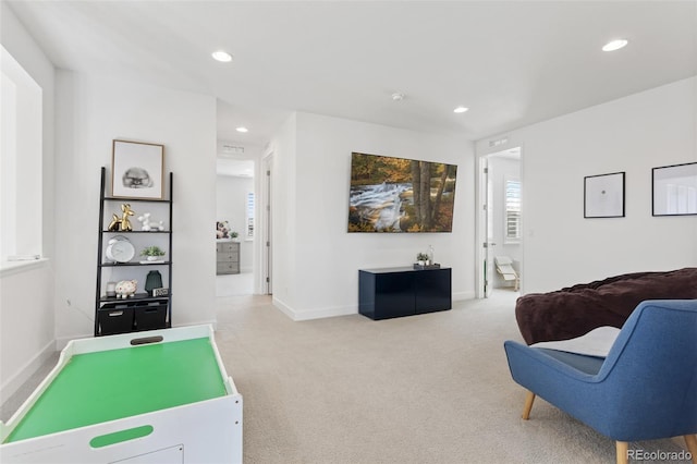 interior space with carpet, baseboards, and recessed lighting