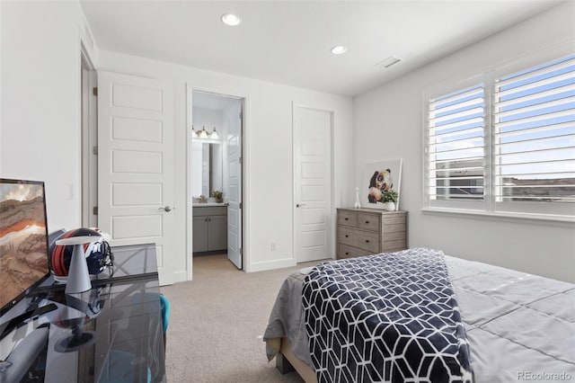 bedroom with connected bathroom, recessed lighting, visible vents, baseboards, and carpet