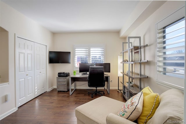 office area featuring baseboards and wood finished floors