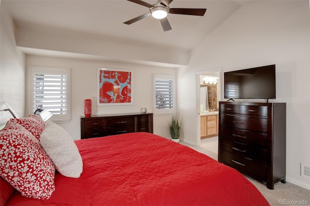 bedroom with visible vents, ensuite bathroom, light carpet, vaulted ceiling, and baseboards