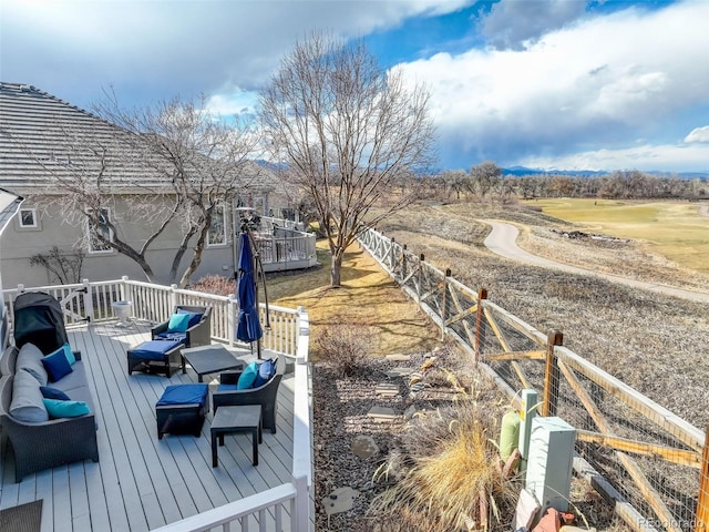 view of dock featuring a wooden deck and fence