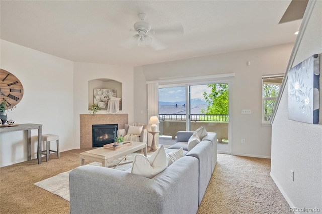 4323 Sammers Vw, Colorado Springs, CO 80917 - living area with carpet flooring, ceiling fan, a tile fireplace, and baseboards