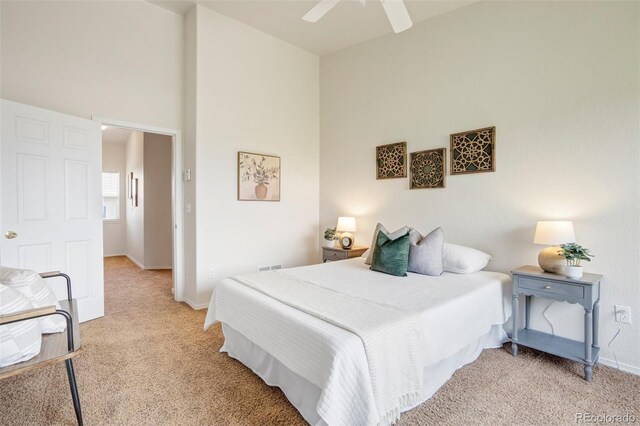 4323 Sammers Vw, Colorado Springs, CO 80917 - bedroom with light carpet, baseboards, ceiling fan, and a towering ceiling