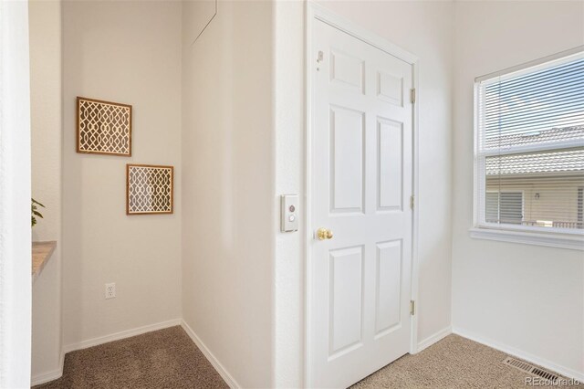 4323 Sammers Vw, Colorado Springs, CO 80917 - hallway featuring light carpet and baseboards