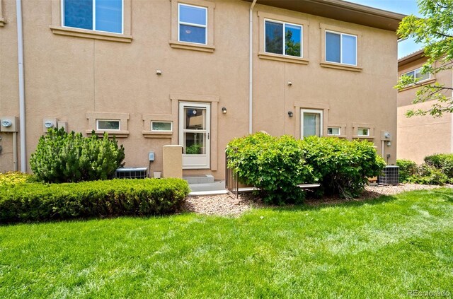 4323 Sammers Vw, Colorado Springs, CO 80917 - back of property with stucco siding, a yard, and central air condition unit