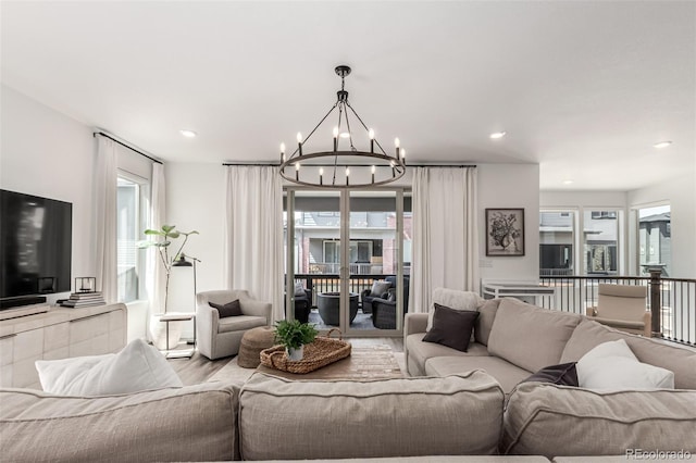 15774 W Girard Ave, Morrison, CO 80465 - living area featuring an inviting chandelier and recessed lighting