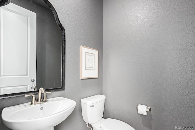 15774 W Girard Ave, Morrison, CO 80465 - bathroom with toilet, a textured wall, and a sink