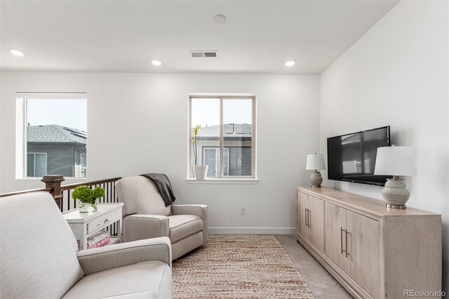 15774 W Girard Ave, Morrison, CO 80465 - living area featuring visible vents, baseboards, recessed lighting, and light carpet