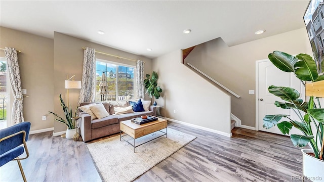 1933 Villageview Ln, Castle Rock, CO 80104 - living room featuring wood finished floors, stairs, baseboards, and recessed lighting