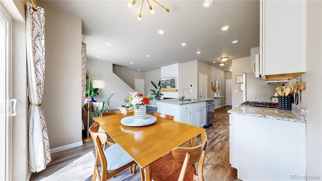 1933 Villageview Ln, Castle Rock, CO 80104 - dining area featuring light wood finished floors, recessed lighting, and baseboards