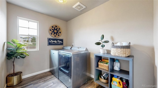 1933 Villageview Ln, Castle Rock, CO 80104 - washroom featuring independent washer and dryer, wood finished floors, and baseboards
