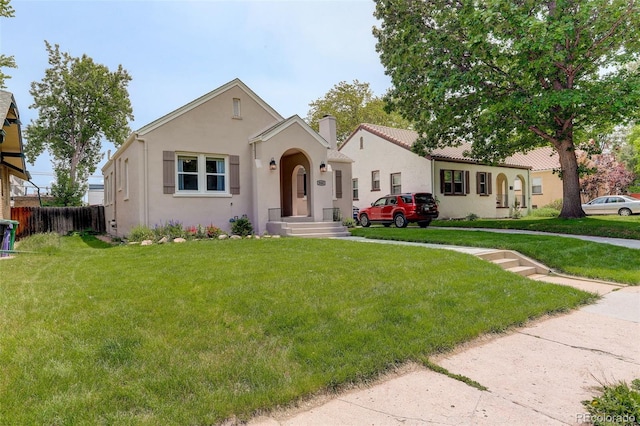 848 Harrison St, Denver, CO 80206 - mediterranean / spanish-style house featuring stucco siding and a chimney