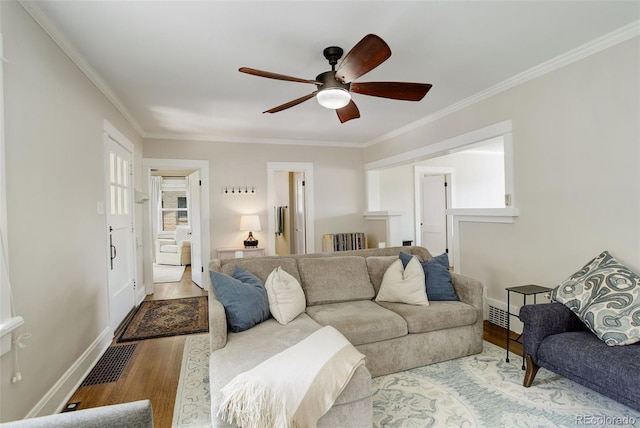 848 Harrison St, Denver, CO 80206 - living area featuring wood finished floors, ornamental molding, ceiling fan, baseboards, and radiator heating unit